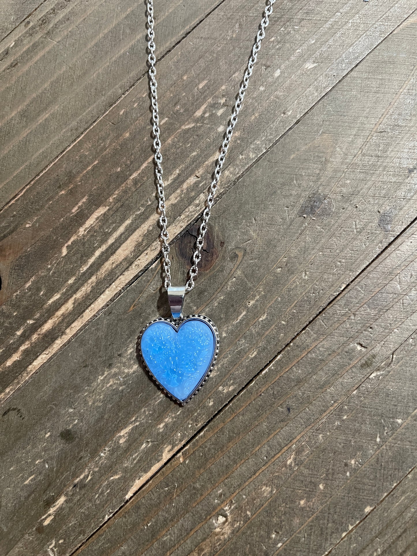 Blue Embossed Floral Heart Pendant on a Silver chain Necklace