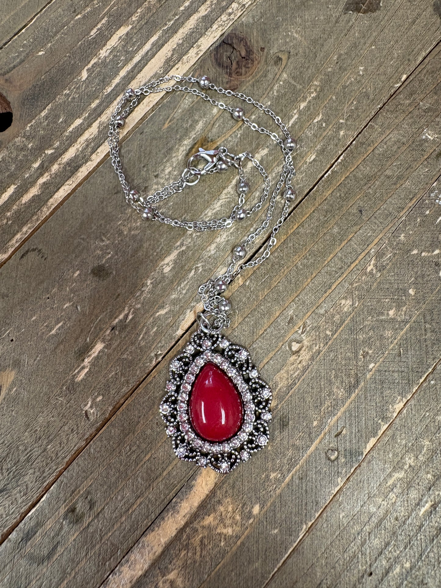Red Stone Teardrop Pendant on a Silver Chain Necklace