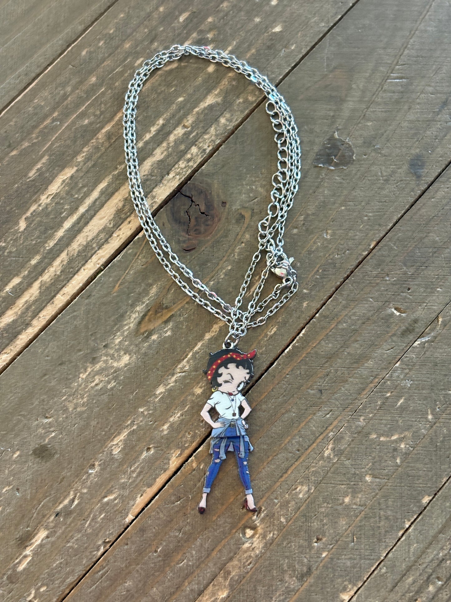 Betty Boop bandana with swinging legs on a silver chain necklace