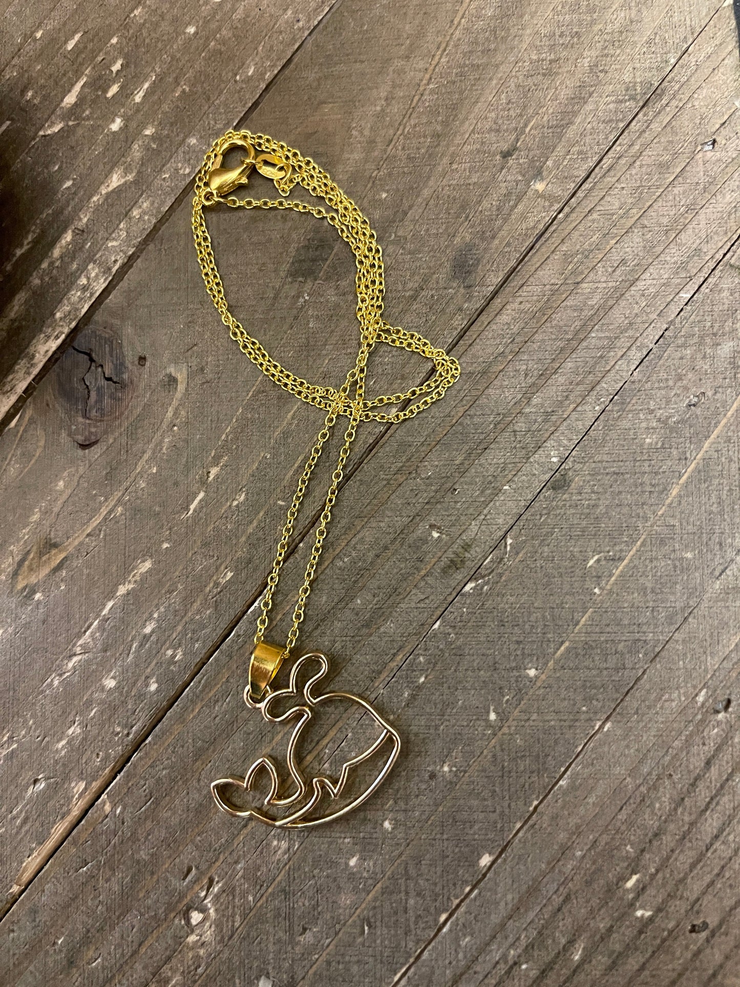Whale Open Pendant on a Gold chain Necklace